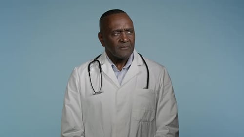 Serious Doctor Looks Off to Side While Thinking