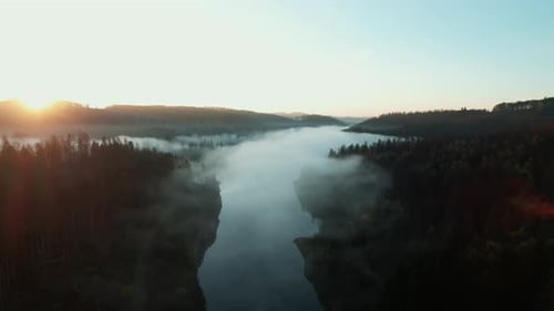 Aerial shot while sunrise at a lake