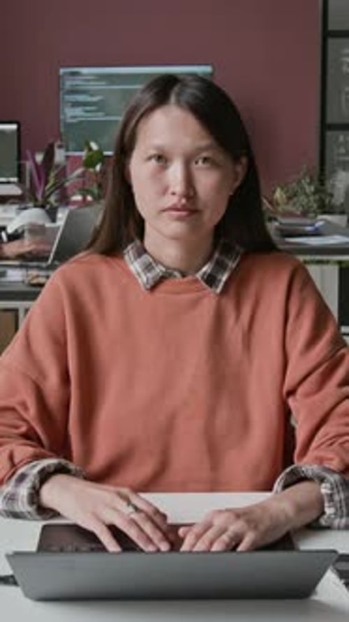 Timelapse Portrait of Asian Female Programmer at Busy IT Startup
