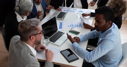 Multiracial Business People Working Inside Bank Office - Meeting and Startup Concept Analysis