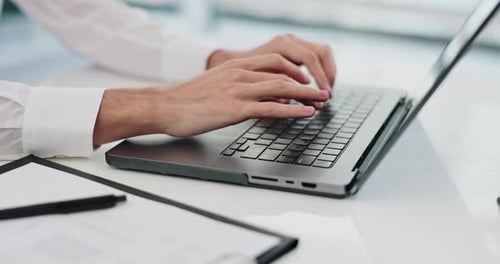 Business Person Typing on Laptop for Web Design Work