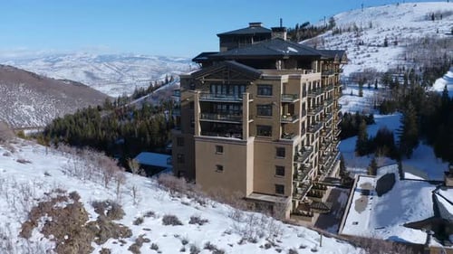 Top-down drone shot of a luxury resort with a pool and sitting area in Deer Valley Park City Utah. M