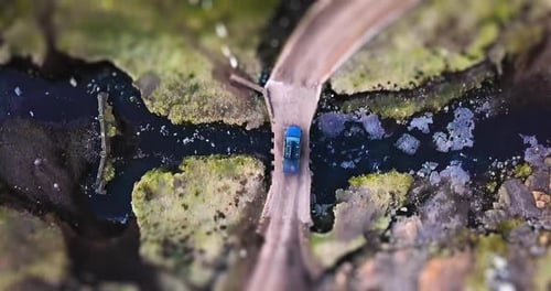 Countryside, road and aerial of car on path for travel, journey and driving for adventure