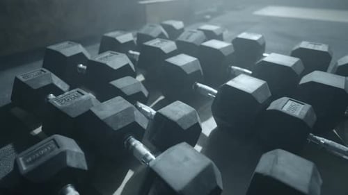 Black Heavy Dumbbells on Floor of Gym Closeup View Sport Activities and Healthy Lifestyle