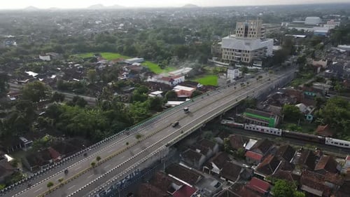 An aerial view of the Gamping flyover in Yogyakarta. This is an overpass with a railway track. A