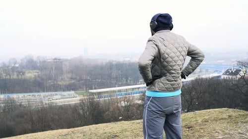 Man, Jogger Finish Running and Admire View in City Park Active