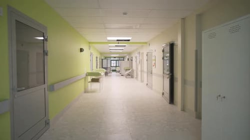 Wide Hospital Corridor Appears Pristine and Organized