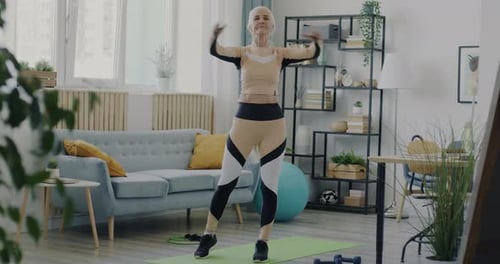 Senior Woman Exercising at Home for Health
