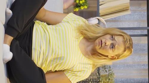 Vertical video of Sick woman with rapid breathing. The woman cannot control her breathing.