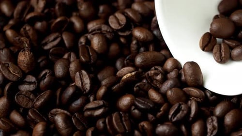 Roasted Coffee Beans Piled on a Woven Mat