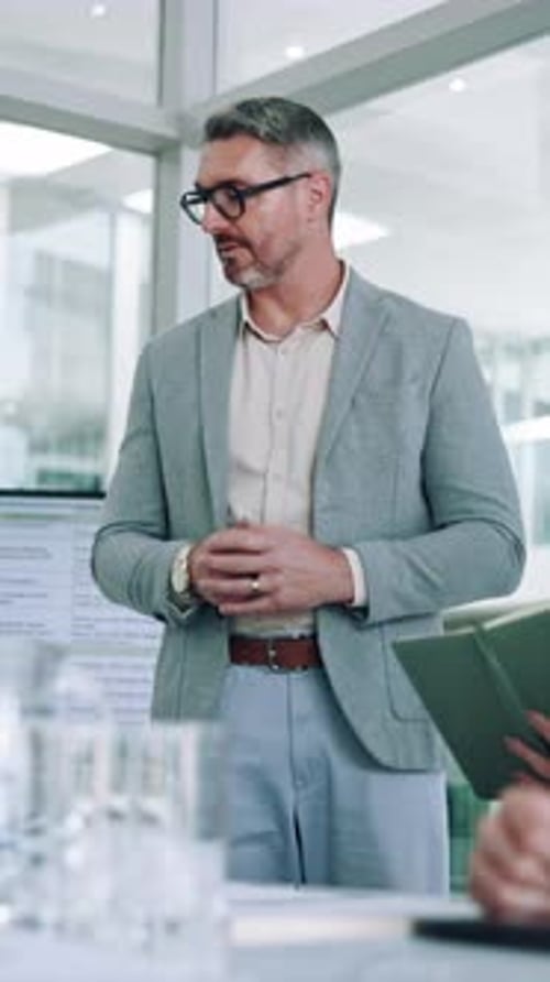 Business, presentation and man in meeting, talking and financial agency with speaker