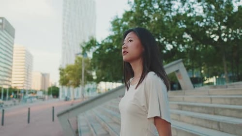 Young Woman Walking in a Modern Urban Environment