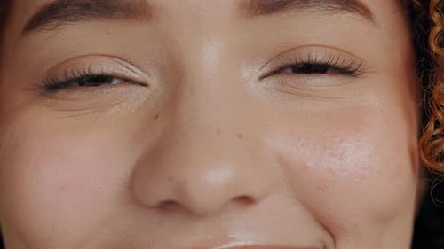 Face, eyes and woman closeup in studio for beauty, makeup and skincare treatment
