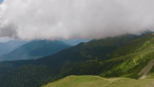 Flight Over Green Hills and Mountains