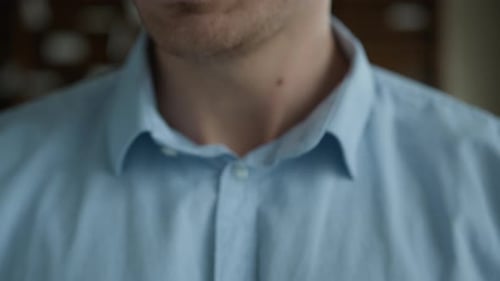 Young Man's Face Up Close in a Home Setting