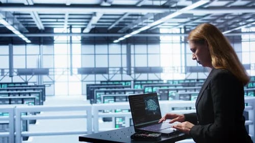 IT Professional Working on Notebook with AI Machine Learning Algorithms