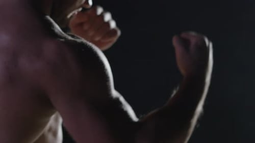 A Dynamic Closeup Shot of a Fighter Intensely Preparing to Deliver a Powerful Strike
