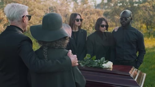 Mourning Family at Funerals at Cemetery