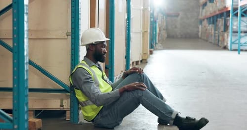 Break, distribution and stress with black man in factory for delivery, logistics or supply chain