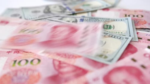Hundred yuan RMB and hundred USD, Chinese and American paper money, flowing on the table, close up,