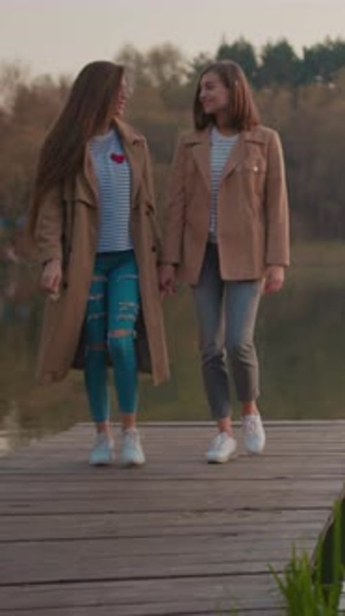 Enjoy a Cozy and Relaxing Autumn Walk By the Water Embracing Natures Beauty Together