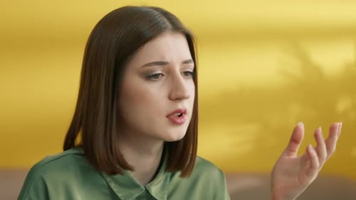 Medium Close Up of Young Pretty Brunette Closing Eyes Shaking Head in Despair