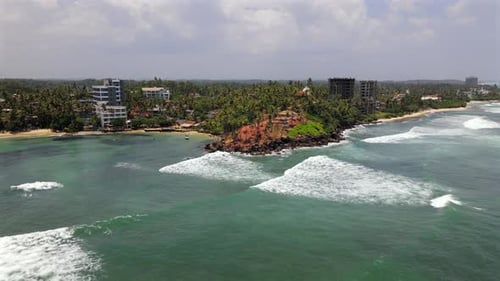 Aerial establisher holiday resort Mirissa in Sri Lanka, coastline panorama
