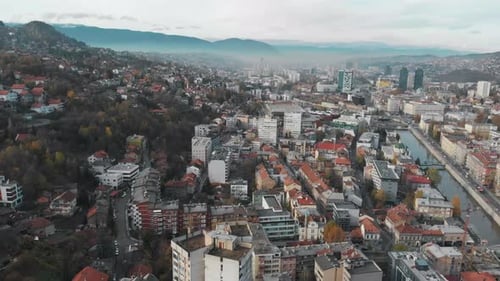 Early morning drone shot in Bosnia's capital Sarajevo. Shot during autumn, the colors of the trees m
