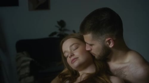 Intimate Couple Embracing in a Domestic Setting