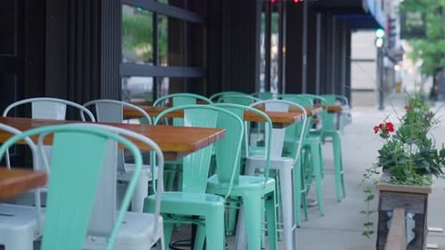 Empty cafe or restaurant closed on holiday or weekend. Empty chairs and tables in chic modern young