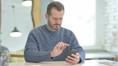 Man Reacts Negatively to Smartphone News
