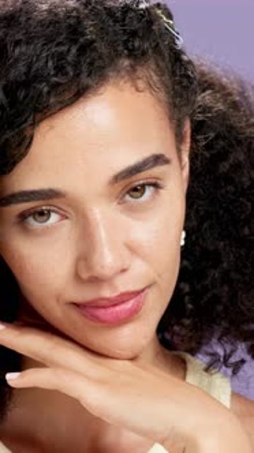 Face, cosmetics and glow with woman in studio for dermatology, cosmetology and touch