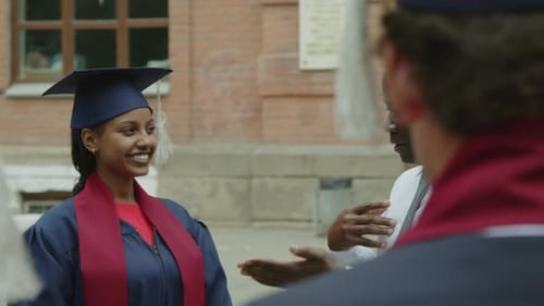 Male Professor Talking to Graduated Students during Ceremony