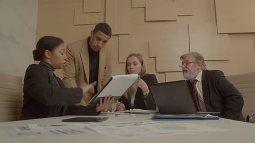 Black Male Executive and Diverse Multiethnic Coworkers Brainstorming at Office