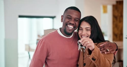 Happy Couple Holding Keys to New Home