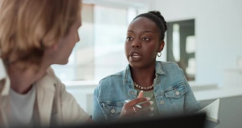 Colleagues Collaborating in Bright Modern Workspace
