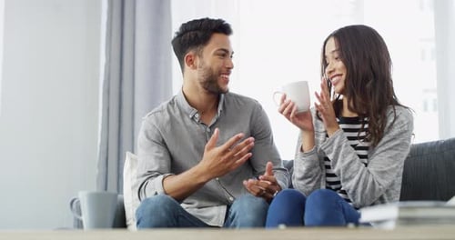 Loving Couple Relaxing Together at Home on Couch