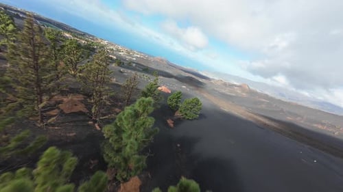 Aerial View of Volcanic Landscape and Distant Town