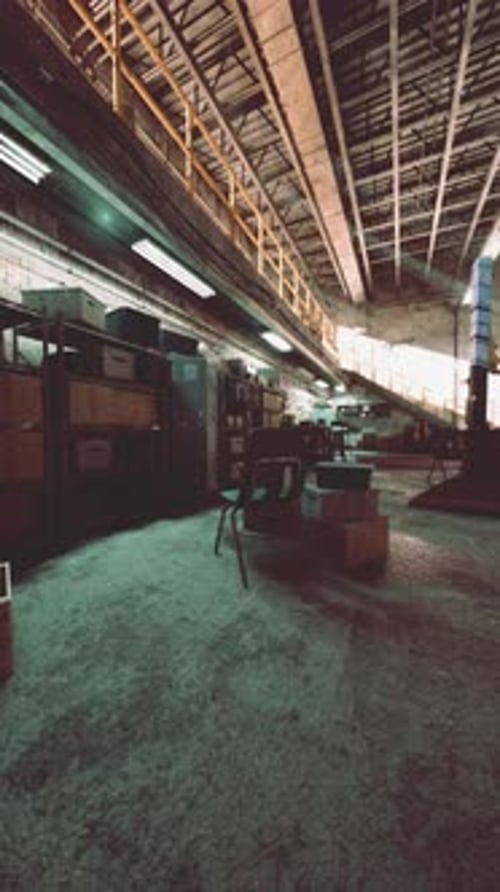 Busy Warehouse With Boxes and Machinery