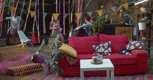 Relaxing Backyard Party with Friends and Colorful Decorations