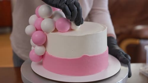 Decorated Pink and White Cake with Spheres