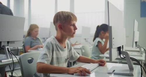 Smart Young Boy Using Computer Doing 3D Design Project Teacher Helping Elementary School Children