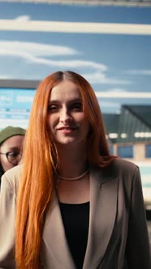 Vertical Video Portrait of Travelers Waiting at Departures Lounge in Busy Airport Terminal