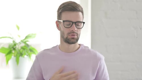 Portrait of Sick Young Man Coughing