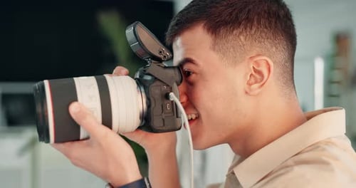 Man, photographer and camera for shooting in studio with smile for creativity