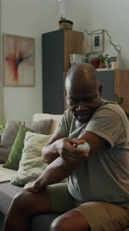 Adult Applying a Device on his Arm