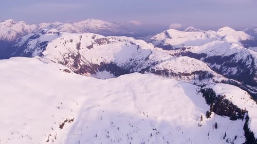 Snowy mountain peaks under blue skies in british columbia Canada wilderness