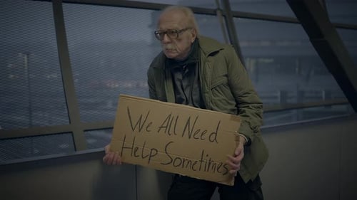 Elderly Homeless Man Suffering From Poverty Looking for Help at Train Station