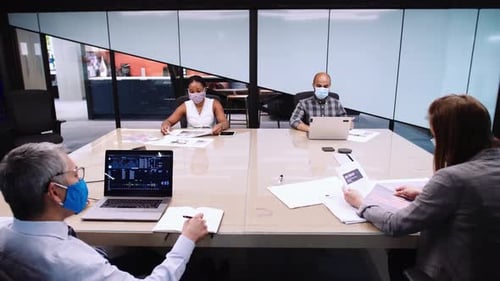 Team in Modern Office Discussing Data