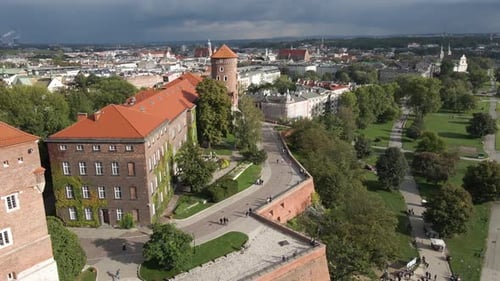 Close drone shot showcasing historic buildings in Krakow Poland on an overcast day. Wawel Royal Cast